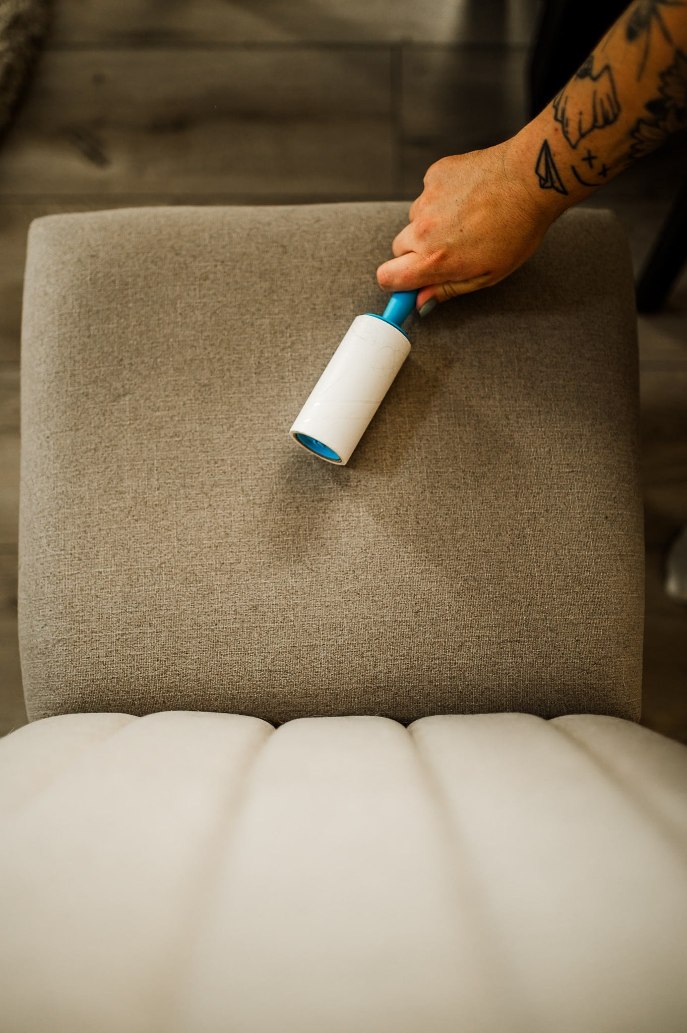 Lint rolling hair off chair